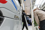 Visitor Observing King Long Bus at IAA 2014