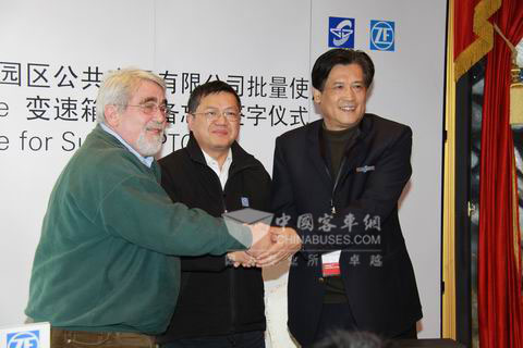 Group photo of both parties at the signing ceremony