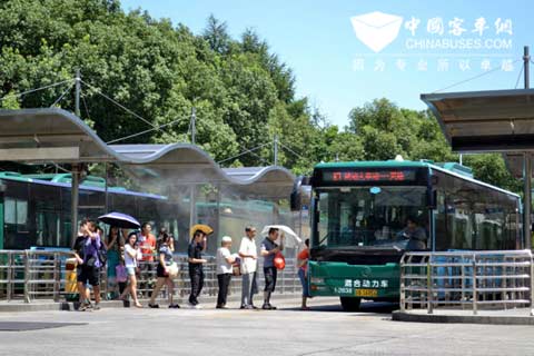 Golden Dragon hybrid bus is driving in the road